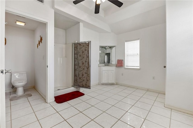 bathroom with a stall shower, baseboards, toilet, tile patterned flooring, and vanity