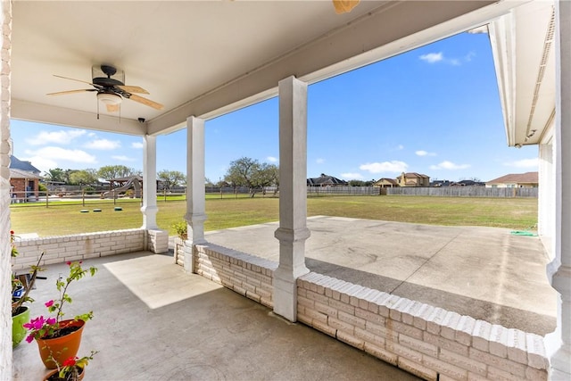 8101 Mt Zion, Corpus Christi, TX 78413 - unfurnished sunroom featuring a ceiling fan and unfinished concrete flooring