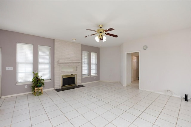 8101 Mt Zion, Corpus Christi, TX 78413 - unfurnished living room with a ceiling fan, a fireplace, and light tile patterned flooring