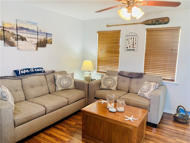 living room featuring ceiling fan and wood-type flooring