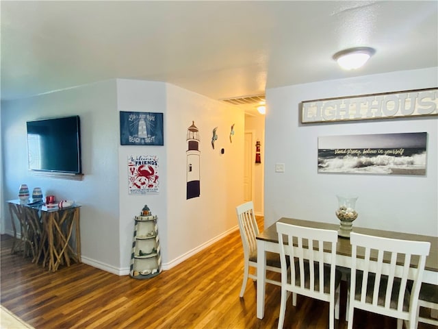 dining room featuring wood-type flooring