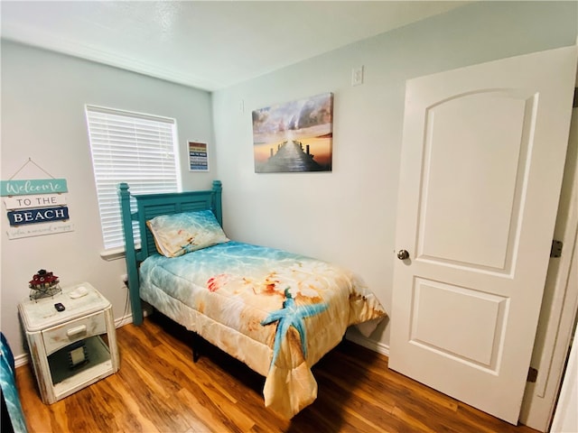 bedroom featuring dark hardwood / wood-style floors