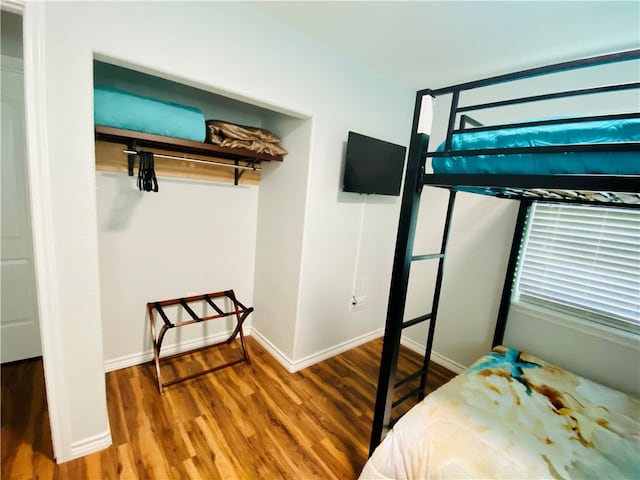 bedroom with hardwood / wood-style floors