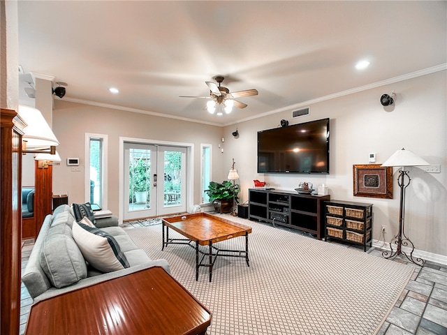 living room with french doors, crown molding, stone tile flooring, visible vents, and baseboards