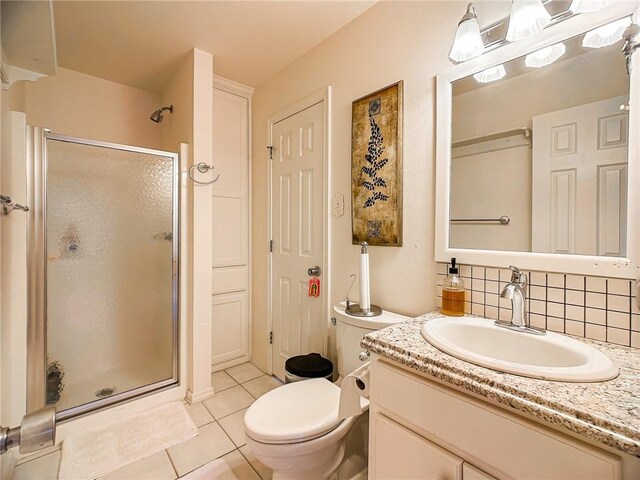 460 Del Mar Blvd, Corpus Christi, TX 78404 - full bath featuring a stall shower, tile patterned flooring, decorative backsplash, and vanity