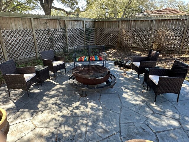 460 Del Mar Blvd, Corpus Christi, TX 78404 - view of patio / terrace with an outdoor fire pit and a fenced backyard