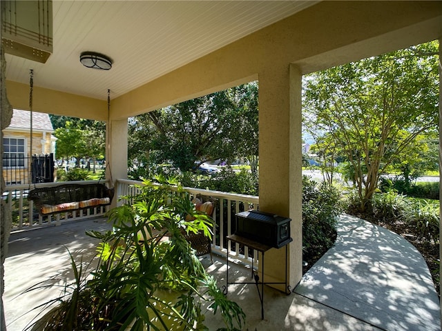 view of patio featuring a porch