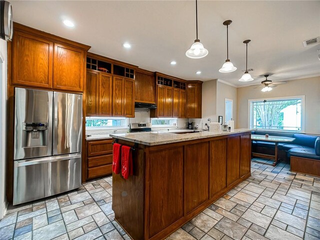 460 Del Mar Blvd, Corpus Christi, TX 78404 - kitchen featuring appliances with stainless steel finishes, under cabinet range hood, light stone finish flooring, a ceiling fan, and recessed lighting