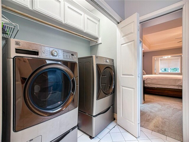 460 Del Mar Blvd, Corpus Christi, TX 78404 - washroom featuring separate washer and dryer, light colored carpet, and light tile patterned floors