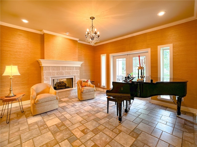 sitting room with recessed lighting, stone tile floors, baseboards, a tiled fireplace, and crown molding