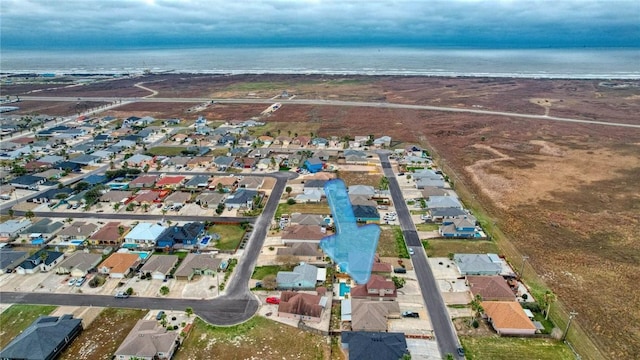 aerial view with a residential view and a water view