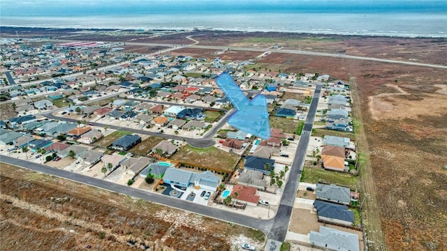 birds eye view of property featuring a residential view and a water view
