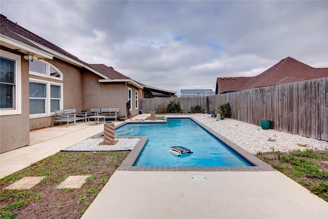 view of swimming pool featuring a fenced backyard, a fenced in pool, and a patio