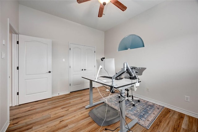 office with light wood-style floors, ceiling fan, and baseboards