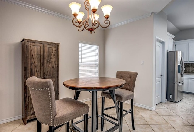 dining room featuring light tile patterned floors, ornamental molding, baseboards, and a notable chandelier