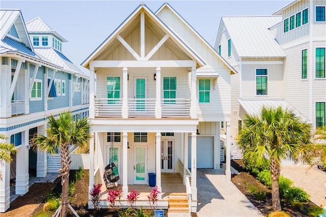 206 Lakeshore St, Port Aransas, TX 78373 - coastal home featuring board and batten siding, a porch, and driveway