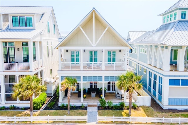 206 Lakeshore St, Port Aransas, TX 78373 - view of front facade with board and batten siding, metal roof, and a standing seam roof