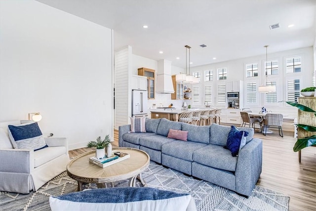 206 Lakeshore St, Port Aransas, TX 78373 - living area featuring light wood-type flooring and recessed lighting