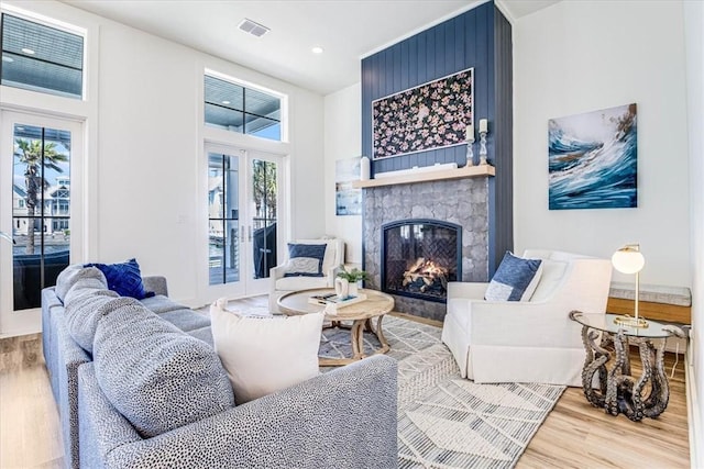 206 Lakeshore St, Port Aransas, TX 78373 - living room with french doors, wood finished floors, plenty of natural light, and recessed lighting