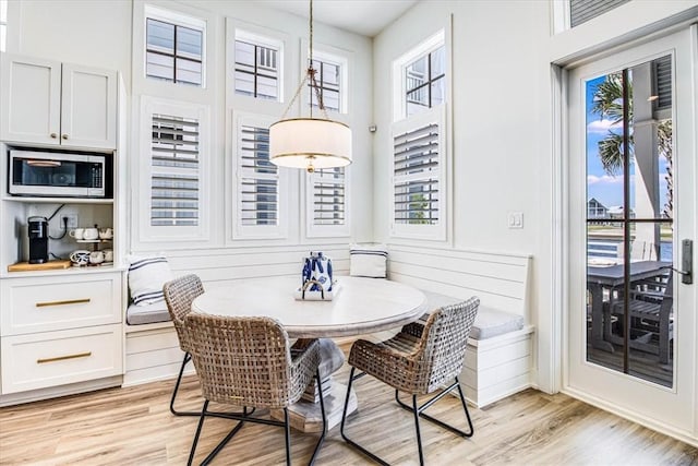 206 Lakeshore St, Port Aransas, TX 78373 - dining room featuring plenty of natural light, light wood-style flooring, and breakfast area