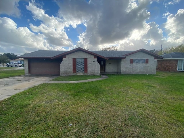 ranch-style house featuring a front yard and a garage