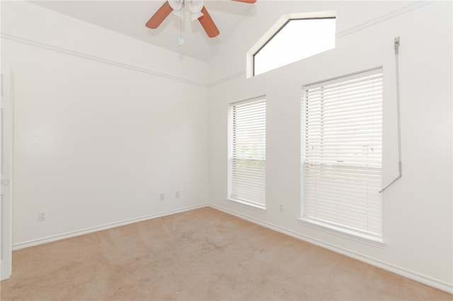 unfurnished room featuring light carpet, ceiling fan, and lofted ceiling