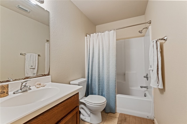 full bathroom with vanity, toilet, and shower / bath combo with shower curtain