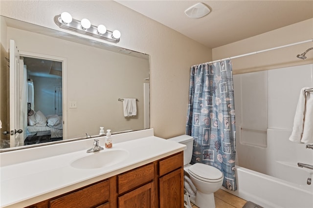 full bathroom with tile patterned flooring, vanity, toilet, and shower / bath combo