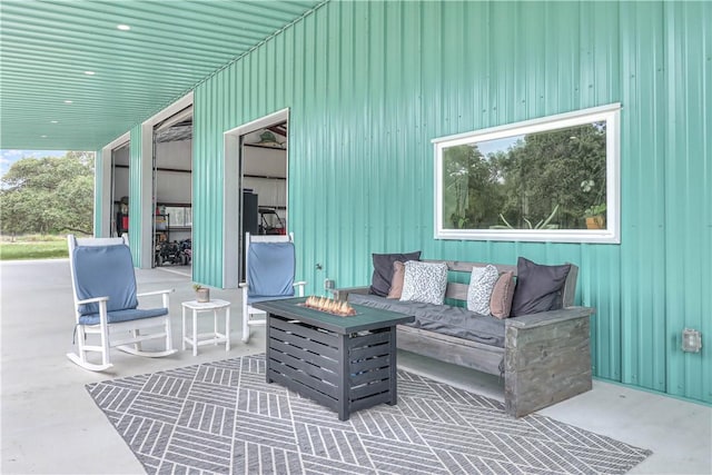 view of patio / terrace featuring an outdoor living space with a fire pit