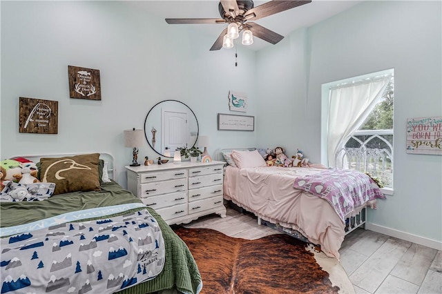 bedroom featuring ceiling fan and light hardwood / wood-style flooring