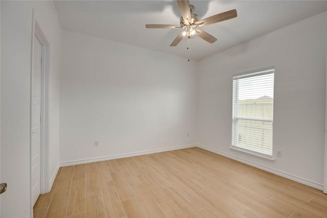 unfurnished room featuring ceiling fan and light wood-type flooring