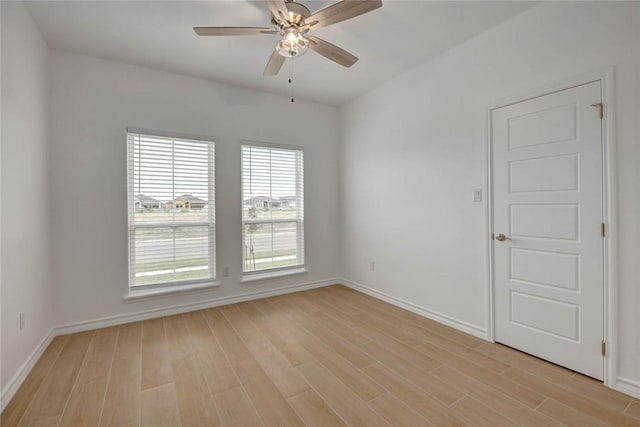 empty room featuring light hardwood / wood-style floors and ceiling fan