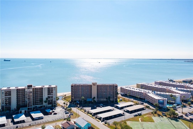 birds eye view of property with a view of city and a water view