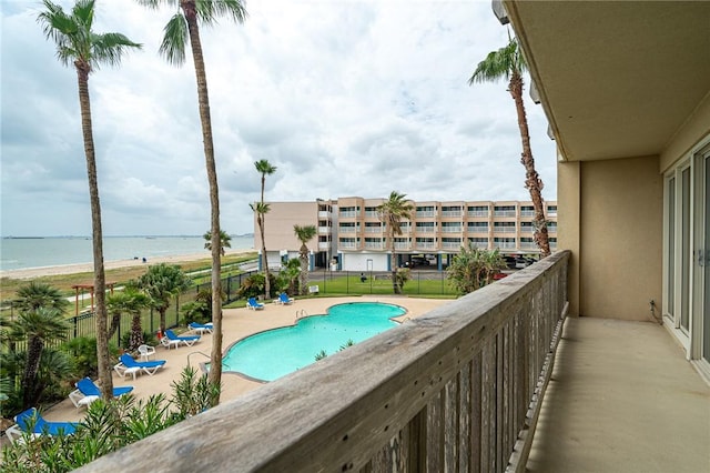 pool with a beach view and a water view