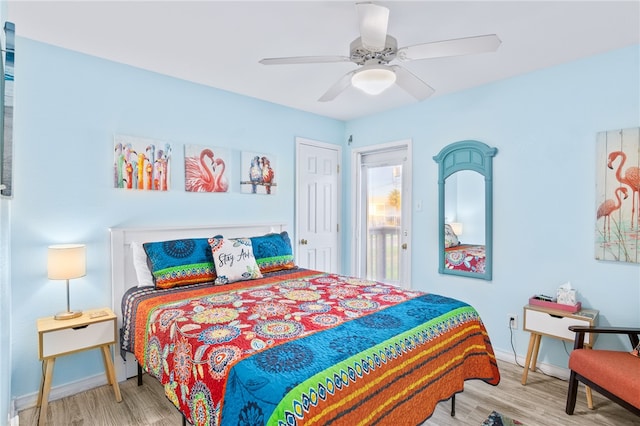 bedroom with ceiling fan and wood-type flooring