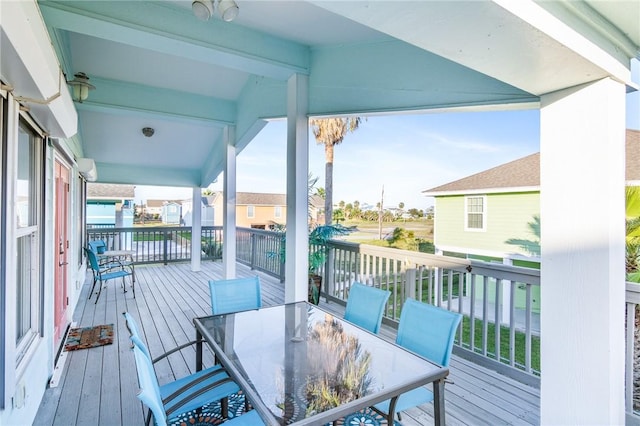 1224 S Live Oak St, Rockport, TX 78382 - wooden terrace with outdoor dining space