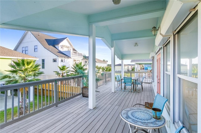 1224 S Live Oak St, Rockport, TX 78382 - wooden deck featuring outdoor dining space