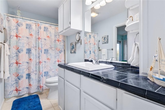1224 S Live Oak St, Rockport, TX 78382 - full bathroom with toilet, tile patterned floors, vanity, and a shower with shower curtain