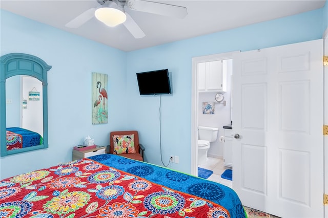 bedroom featuring light tile patterned floors, connected bathroom, and ceiling fan