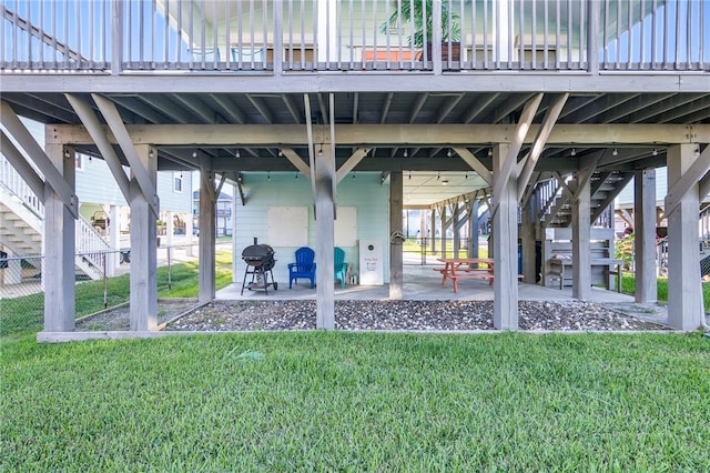 view of home's community featuring a deck, a yard, and a patio