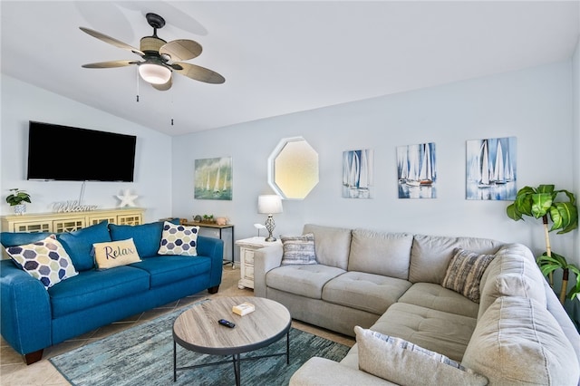 living room with tile patterned floors, ceiling fan, and lofted ceiling