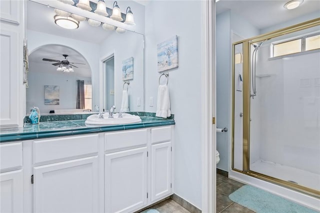 1224 S Live Oak St, Rockport, TX 78382 - bathroom with a stall shower, vanity, toilet, and ceiling fan