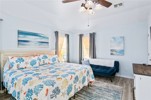 bedroom with light hardwood / wood-style flooring and ceiling fan