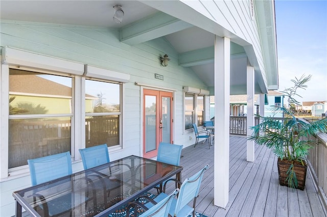 1224 S Live Oak St, Rockport, TX 78382 - wooden terrace featuring outdoor dining area and french doors