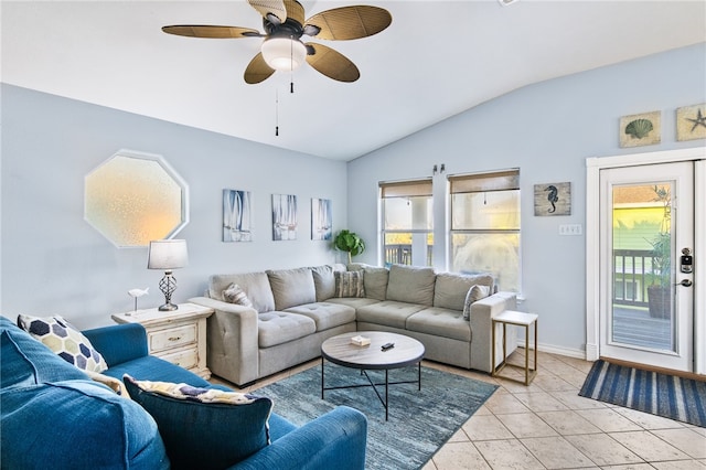 tiled living room with ceiling fan and lofted ceiling