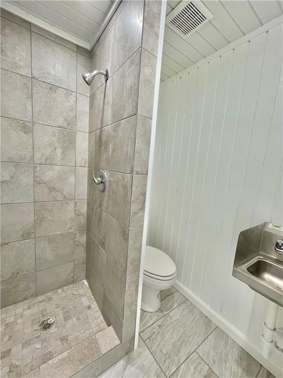 1238 Baywood Ln, Corpus Christi, TX 78418 - bathroom with toilet and a tile shower