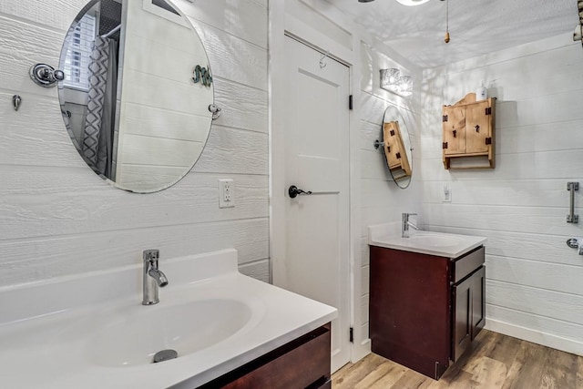 bathroom with hardwood / wood-style flooring and vanity