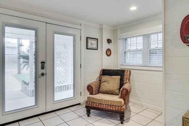 entryway featuring french doors and light tile patterned floors