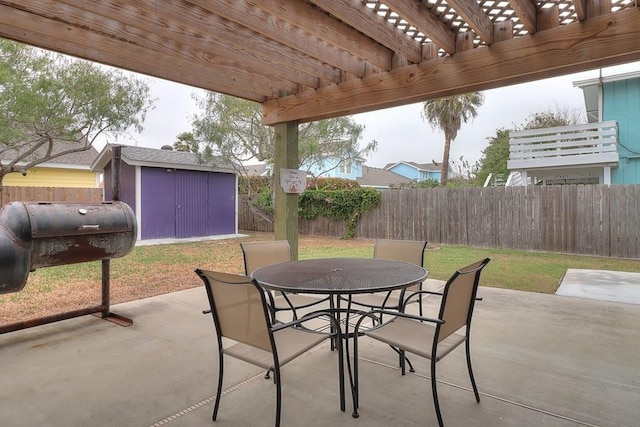 view of patio / terrace with a pergola and a storage shed