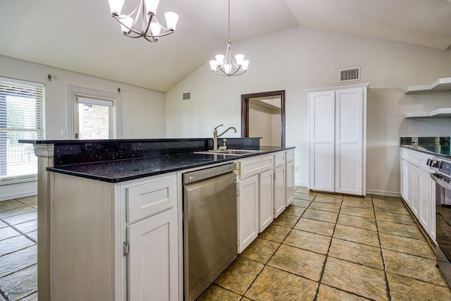 kitchen featuring stainless steel dishwasher, lofted ceiling, sink, and white cabinets